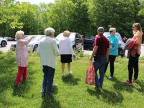 Participants and volunteers for Walking For Grief set out along one of the trails at Lemoine Point Conservation Area in Kingston, Ont. on Tuesday May 31, 2016. Julia Balakrishnan for the Whig-Standard/Postmedia Network