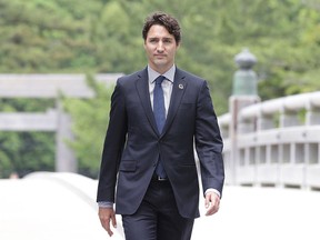 Prime Minister Justin Trudeau walks on the Ujibashi bridge as he visits at the Ise-Jingu Shrine on May 26, 2016 in Ise, Japan. (Chung Sung-Jun/Getty Images)