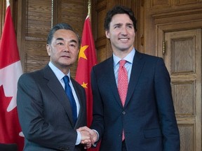 Prime Minister Justin Trudeau, right, meets with Chinese Foreign Minister Wang Yi on Parliament Hill in Ottawa, Wednesday June 1, 2016. THE CANADIAN PRESS/Adrian Wyld