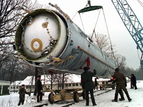 In this Dec. 24, 1997 file photo, soldiers prepare to destroy a ballistic SS-19 missile in the yard of the largest former Soviet military rocket base in Vakulenchuk, Ukraine. Inuit in two countries are angry over Russian plans to drop a rocket stage potentially carrying highly toxic fuel into some of the most productive waters in the Arctic. THE CANADIAN PRESS/AP, File