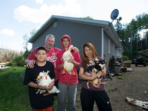 Nathan, Derek, Justin and Marie Manshanden returned to their acreage outside of Fort McMurray to discover some of their ducks left behind when they fled the wildfires had been taken care of by a neighbour.