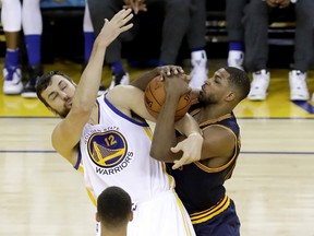 Andrew Bogut of the Golden State Warriors and Tristan Thompson of the Cleveland Cavaliers fight for a rebound in Game 2 of the NBA Finals at ORACLE Arena in Oakland on June 5, 2016. (Ronald Martinez/Getty Images/AFP)