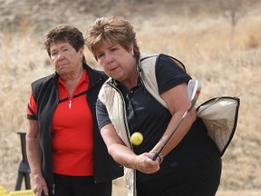 Dianne, left, and Kristy Hutton started Golfaround in 1997 with 12 participants, the program has grown to accommodate 650 wormen each year. (File)