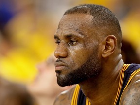 LeBron James of the Cleveland Cavaliers sits on the bench in the fourth quarter of Game 2 of the NBA Finals against the Golden State Warriors in 
Oakland at ORACLE Arena on June 5, 2016. (Ezra Shaw/Getty Images/AFP)