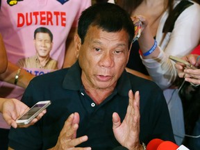 In this April 29, 2016 file photo, presidential candidate Rodrigo Duterte answers questions from the media in Manila, Philippines. The Philippine president-elect encouraged the public to help him in his war against crime and urged citizens with guns to shoot and kill drug dealers who would resist arrest and fight back in their neighbourhoods. (AP Photo/Bullit Marquez, File)