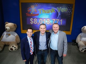 Alex Munter, left, Graham Richardson, centre, and Kevin Keohane Chief Operating Officer, CHEO Foundation, pose for a photo with the final tally of $8,013,771 at the CHEO telethon at the EY Centre in Ottawa on Sunday, June 5, 2016. Patrick Doyle, Postmedia Network