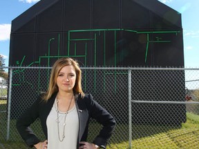 Paige MacPherson, Alberta Director for the Canadian Taxpayer Federation, poses at the newly unveiled Forest Lawn Lift Station in southeast Calgary, Alta on Sunday September 27, 2015. The City of Calgary paid $250,000 (approx) to install lighting on the building. Jim Wells/Postmedia Network