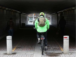 Cyclists and pedestrians share a tunnel going under the Campus transit station at the University of Ottawa. Jean Levac