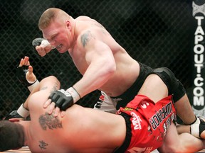 In this Feb. 2, 2008, file photo, Brock Lesnar, top, fights Frank Mir during their UFC 81 heavyweight bout at Mandalay Bay Events Center in Las Vegas. (AP Photo/Las Vegas Review-Journal, Ronda Churchill)
