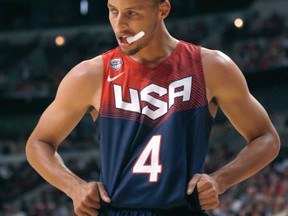 In this Aug. 16, 2014, file photo, United States guard Stephen Curry is shown during an exhibition basketball game against Brazil in Chicago. (AP Photo/Charles Rex Arbogast, File)
