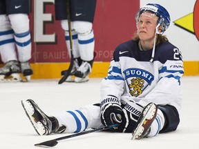 Finland’s Patrik Laine sits on the ice after losing the World Championship final to Canada in Moscow, Russia, on Sunday, May 22, 2016. (THE CANADIAN PRESS/AP/Pavel Golovkin)