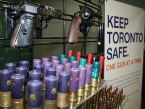 Some of the guns and ammunition surrendered to Toronto Police as part of its Pixels for Pistols gun amnesty program in 2013. (Terry Davidson/Toronto Sun)
