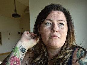 Claire Woodall has a tattoo on her arm in honour of her late husband, Const. Dan Woodall, who died in the line of duty, as she made herself available to the media just days before the first anniversary of his death in Edmonton, June 6, 2016. ED KAISER/Postmedia Network