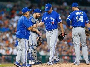 Blue Jays manager John Gibbons (left) takes the ball from relief pitcher Gavin Floyd (39) in the sixth inning against the Tigers during MLB action in Detroit on Monday, June 6, 2016. (Paul Sancya/AP Photo)