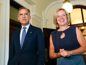 Mark Carney, Governor of the Bank of England, and Rachel Notley emerge from the Premier's office to speak with the news media at the Alberta Legislature on June 6, 2016. LARRY WONG/Postmedia Network