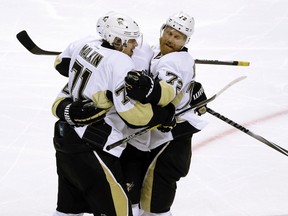 Penguins forward Evgeni Malkin (left) celebrates with Patric Hornqvist (72) after scoring a goal against the Sharks during the second period of Game 4 of the Stanley Cup final in San Jose, Calif., on Monday, June 6, 2016. (Eric Risberg/AP Photo)