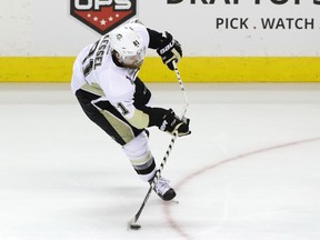Penguins forward Phil Kessel breaks his stick while taking a shot against the Sharks in Game 3 of the Stanley Cup final at SAP Center in San Jose, Calif., on Saturday, June 4, 2016. The Penguins are one win away from winning the Stanley Cup after defeating the Sharks 3-1 in Game 4 on Monday. (Ezra Shaw/Getty Images/AFP)