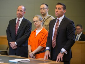 In this May 29, 2015 file photo, Angelika Graswald, centre, stands in court with her attorneys Jeffrey Chartier, left, and Richard Portale at her arraignment in Goshen, N.Y. Authorities say Graswald removed a drain plug from Vincent Viafore's kayak in April 2015 and pushed a floating paddle away from him after his kayak capsized. A Cornwall police officer testified Monday, June 7, 2016, Graswald appeared calm and emotionless after she was rescued. (Allyse Pulliam/Times Herald-Record via AP, Pool, File)