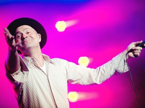 Singer Gord Downie is shown in this film photo as The Tragically Hip perform on the Bell stage Friday July 17, 2015 at RBC Ottawa Bluesfest. The band's upcoming album includes a song titled In Sarnia.
File photo/Postmedia