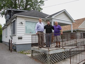 Peter Cory, executive director, left along with case worker Shawn Holder and volunteer mentor Norman Trembath, stand on the front ramp of the Big Brothers Big Sisters Kingston, Frontenac, Lennox and Addington location at 1344 Princess St. in Kingston. The agency will be moving in August to a community hub at 817 Division St. (Julia McKay/The Whig-Standard)