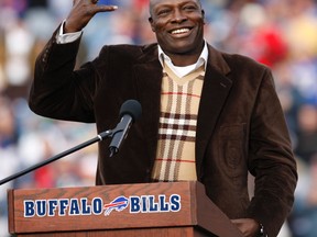 Former Buffalo Bills defensive end Bruce Smith smiles during his Hall of Fame ring ceremony at halftime of an NFL football game between the Bills and the Miami Dolphins in Orchard Park, N.Y., on Sunday, Nov. 29, 2009. (AP Photo/ Dean Duprey)