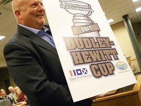 Tournament organizing committee member Rob MacDonald unveils the 2017 Dudley Hewitt Cup logo earlier this week at QW council. Trenton will host the Central Canada Jr. A hockey championship next year. (Ernst Kuglin/The Intelligencer)