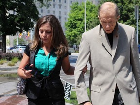 Maygan Sensenberger, 26, leaves the Ottawa courthouse on Tuesday, July 21, 2015 with her husband, retired Liberal Senator Rod Zimmer. Sensenberger got probation after pleading guilty to mischief, a weapons charge and a breach relating to two incidents in 2014 and 2015, one of which saw her arrested at gunpoint. (TONY SPEARS/Ottawa Sun/Postmedia Network)