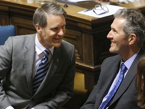 Finance Minister Cameron Friesen (left) chats with Premier Brian Pallister prior to delivering the budget last week. (Brian Donogh/Winnipeg Sun file photo)