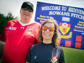 Gordon and Kathleen Stringer appear at the renaming of the rugby pitch in Barrhaven, Ont., to Rowan's Pitch in early April. The Ontario legislature passed Rowan's Law on June 7, 2016, named after Rowan Stringer, a high school rugby player who died in March 2013 after repeated concussions. (Ashley Fraser/Postmedia/Files)