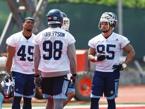 Toronto Argonauts Trevardo Williams DL, Tracy Robertson DL and Ricky Foley DL during a cool down  during practice in Guelph, Ont. on Thursday June 2, 2016. (Jack Boland/Toronto Sun/Postmedia Network)