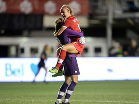 Canada's Josee Belanger jumps into goalkeeper Stephanie Labbe's arms after scoring the game winning goal against Brazil on June 7 at TD Place. (THE CANADIAN PRESS/Sean Kilpatrick)