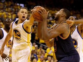 Tristan Thompson of the Cleveland Cavaliers (right) says that his team wants to push the tempo of play against the Golden State Warriors in Game 3 of the NBA Finals, despite evidence suggesting that a slower pace better suits the Cavaliers. (EZRA SHAW/Getty Images/AFP)