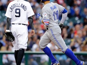 Blue Jays' Kevin Pillar (11) rounds the bases past Tigers third baseman Nick Castellanos after hitting a solo home run during the fifth inning in Detroit on Tuesday, June 7, 2016. (Duane Burleson/AP Photo)