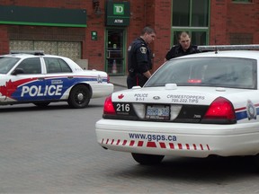 Jim Moodie/Sudbury Star
Greater Sudbury Police officers respond to an incident downtown on Tuesday that involved an altercation between two women.