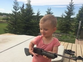 This photo of a local toddler, Jaxson, holding a BB gun has caused a stir on social media. (Facebook)