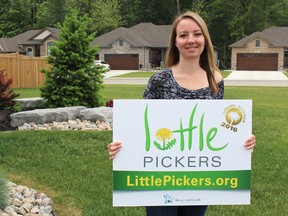 Little Pickers founder Tina Irvine is pictured here in the frontyard of her Corunna home Wednesday. The Corunna graphic designer and mother recently launched the lawn care organization to provide youth with employment opportunities. Barbara Simpson/Sarnia Observer/Postmedia Network