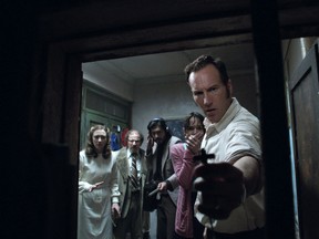 This image released by Warner Bros. shows, from left, Vera Farmiga, Simon McBurney, Abhi Sinha, Frances O'Connor and Patrick Wilson in a scene from the New Line Cinema thriller, "The Conjuring 2." (Warner Bros. via AP)