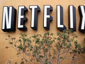 In this April 22, 2011 file photo, the Netflix logo is displayed at the company's headquarters in Los Gatos, Calif. (AP Photo/Paul Sakuma, File)