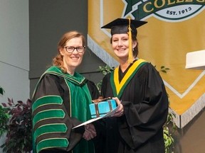 President's Medal recipient Jana MacLeod, of Fort McMurray, Alta., accepts the award from Lakeland College President-CEO Alice Wainwright-Stewart during the afternoon Convocation on Friday, June 3. Taylor Hermiston/Vermilion Standard/Postmedia Network
