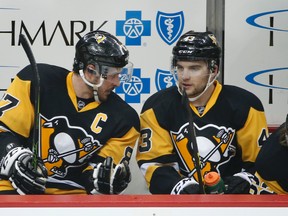 Penguins captain Sidney Crosby (left) chats with teammate Conor Sheary (right) during NHL playoff action in Pittsburgh on May 2, 2016. The Penguins are one win away from claiming the franchise's fourth Stanley Cup championship. (Gene J. Puskar/AP Photo)