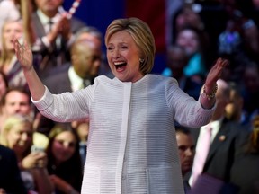 Democratic presidential candidate Hillary Clinton celebrates on stage during her primary night event at the Duggal Greenhouse, Brooklyn Navy Yard, June 7, 2016 in New York. (AFP)