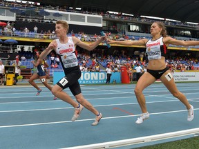 Dean Ellenwood takes the handoff from Winnipegger Victoria Tachinski on the Canada 4x400m relay during last year's IAAF World Youth Championships at Estadio Olimpico Pascual Guerrero. (Kirby Lee-USA TODAY Sports file photo)