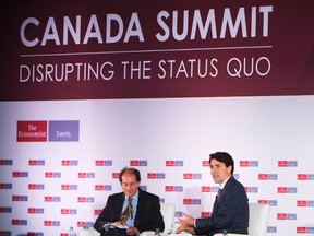 Prime Minister Justin Trudeau, right, speaks as the keynote interview with moderator Brooke Unger at The Canada Summit - Disrupting the Status Quo, organized by The Economist in Toronto on Wednesday, June 8, 2016. THE CANADIAN PRESS/Nathan Denette