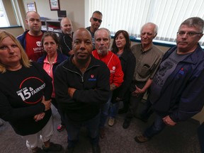 Colin James, centre, president of Unifor Canada Local 222, and fellow members who work at the Oshawa General Motors plant are seen Wednesday June 8, 2016. (Jack Boland/Toronto Sun)
