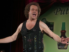 In this June 2, 2006, file photo, Richard Simmons speaks to the audience before the start of a summer salad fashion show at Grand Central Terminal in New York. Simmons told USA Today on June 5, 2016, that he was "feeling great" after being hospitalized for dehydration. (AP Photo/Tina Fineberg, File)