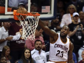 Cavaliers forward LeBron James dunks against the Warriors during the second half of Game 3 of the NBA Finals in Cleveland on Wednesday, June 8, 2016. (Ron Schwane/AP Photo)