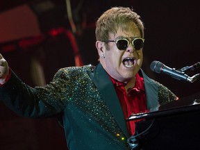 Musician Elton John performs at his concert in the Crocus City Hall outside Moscow, Russia, Monday, May 30, 2016. (AP Photo/Pavel Golovkin)