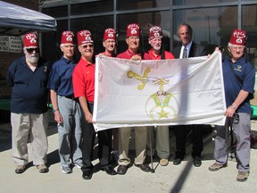 Members of the Ahcom Shriners Club stand with Mayor Randy Hope with the Shriners Flag, from left to right: Larry Heather, Bob Bye, Bob Pennington, Wayne O'Sullivan, Mike Ternovan (current president), George Sims, Mayor Randy Hope, and Gary Eagleson.