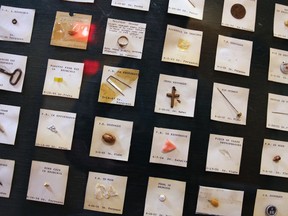 A variety of items ingested by children, from a sardine can key to a crucifix, are displayed at Boston Children's Hospital in Boston, Wednesday, June 8, 2016. The items are part of a collection of items ingested by children, a gruesome reminder to dozens of parents who walk past them every day, at the entrance of the hospital's ear, nose and throat department. Children’s doctor Anne Hseu says it catches the eye of parents and warns them to be careful of what their child is exposed to. (AP Photo/Charles Krupa)