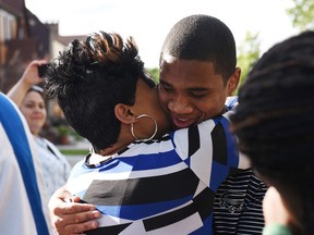 Davontae Sanford is reunited with his mother, Taminko Sanford-Tilmon at their home in Detroit on Wednesday, June 8, 2016, after being released from prison. (Robin Buckson/The Detroit News via AP)